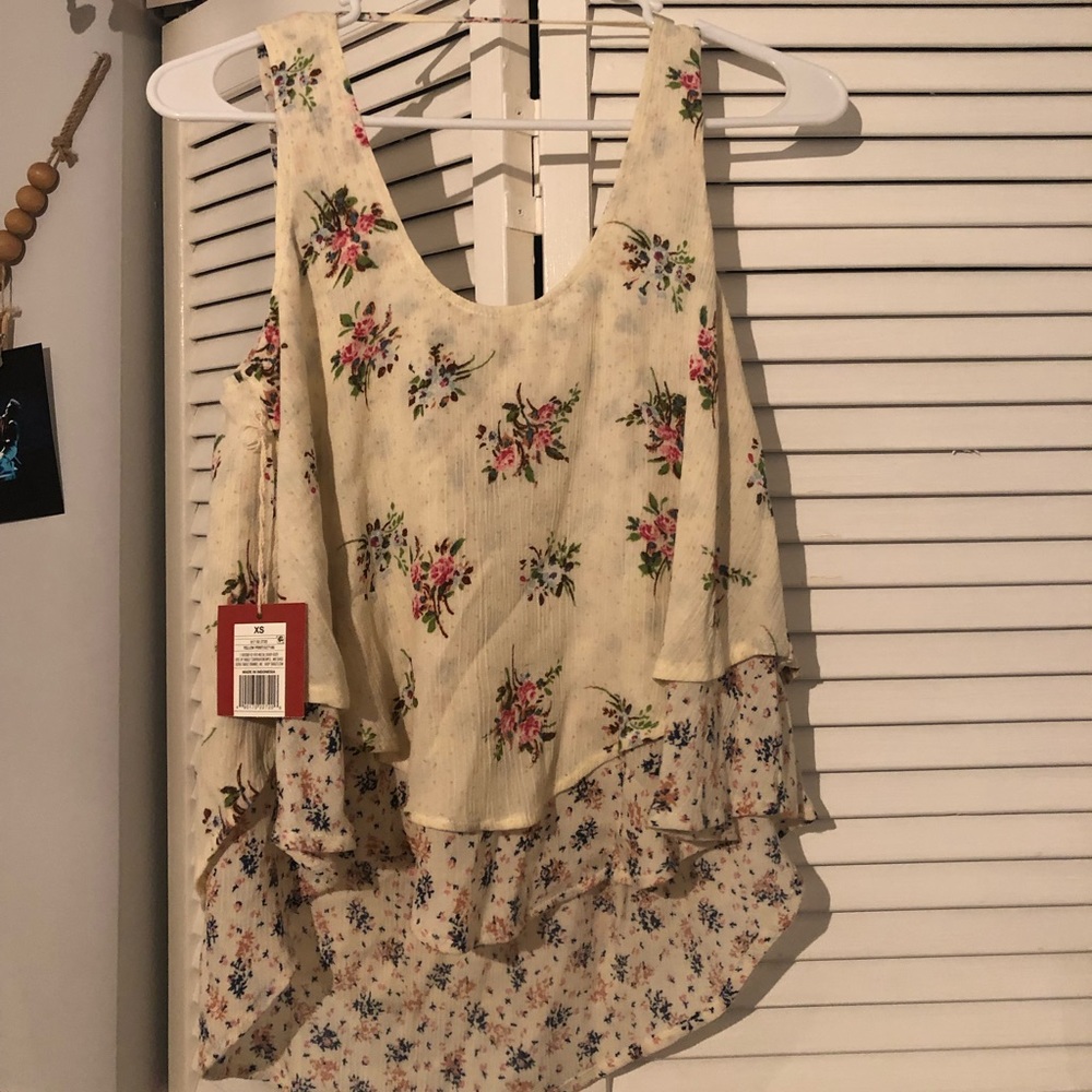 High low tank top with a strapped  back